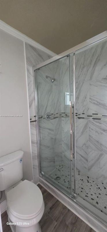 Bathroom, Glass Shower, Interior, Marble Walls, Wood Texture Flooring