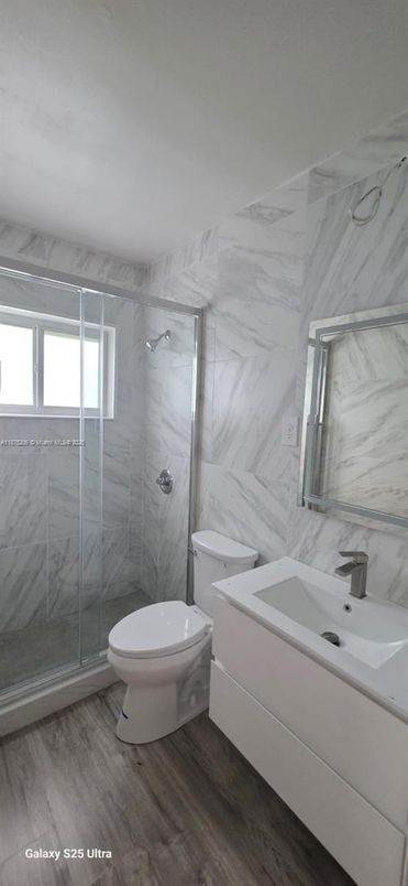 Bathroom, Glass Shower, Interior, Marble Walls, Wood Texture Flooring