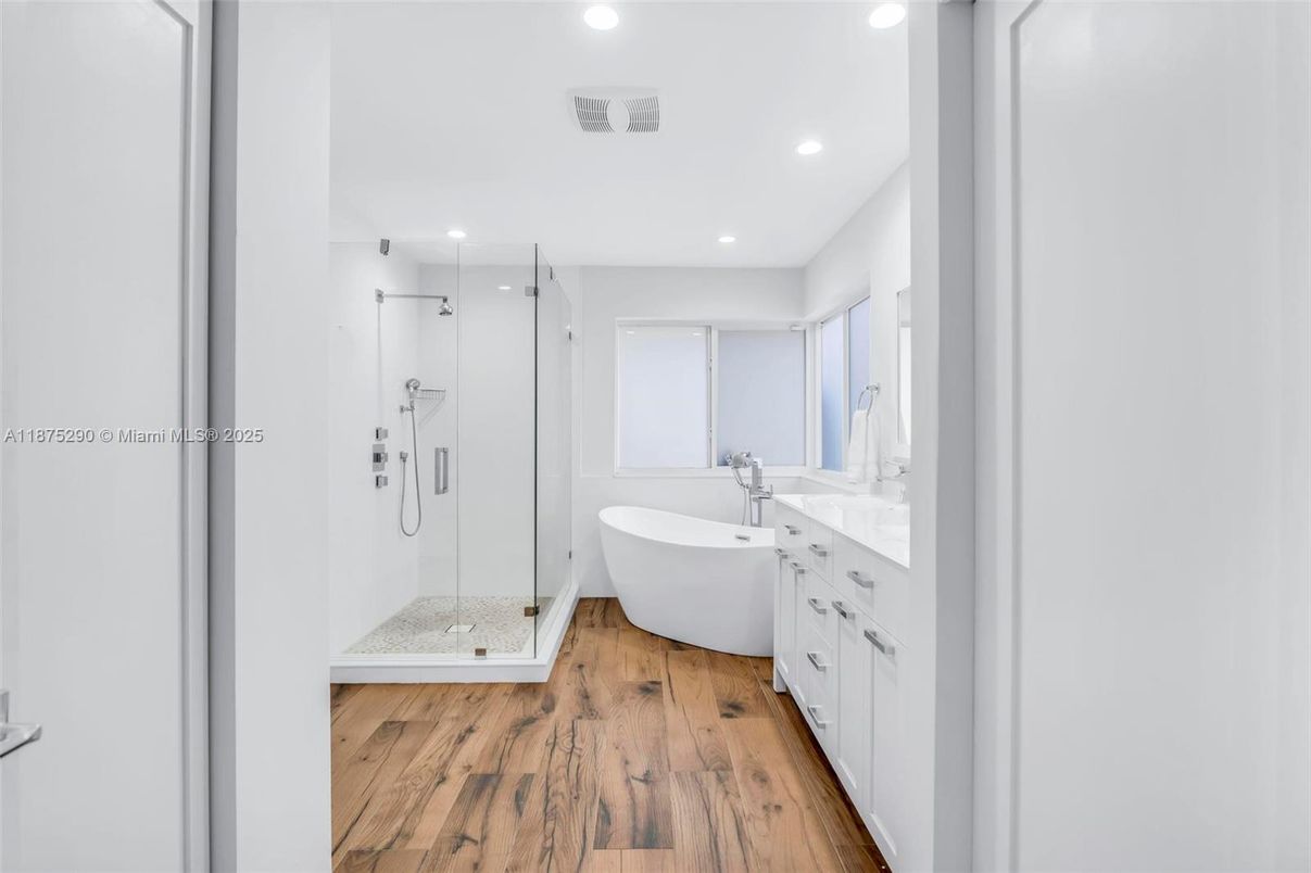 Bathroom, Dual Sink Vanities, Free Standing Baths, Glass Shower, Interior, Recessed Lighting, Wood Texture Flooring
