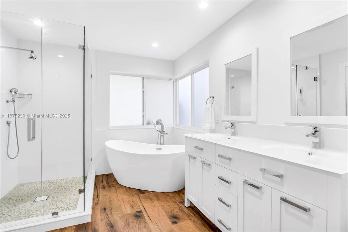 Bathroom, Dual Sink Vanities, Free Standing Baths, Glass Shower, Interior, Recessed Lighting, Wood Texture Flooring