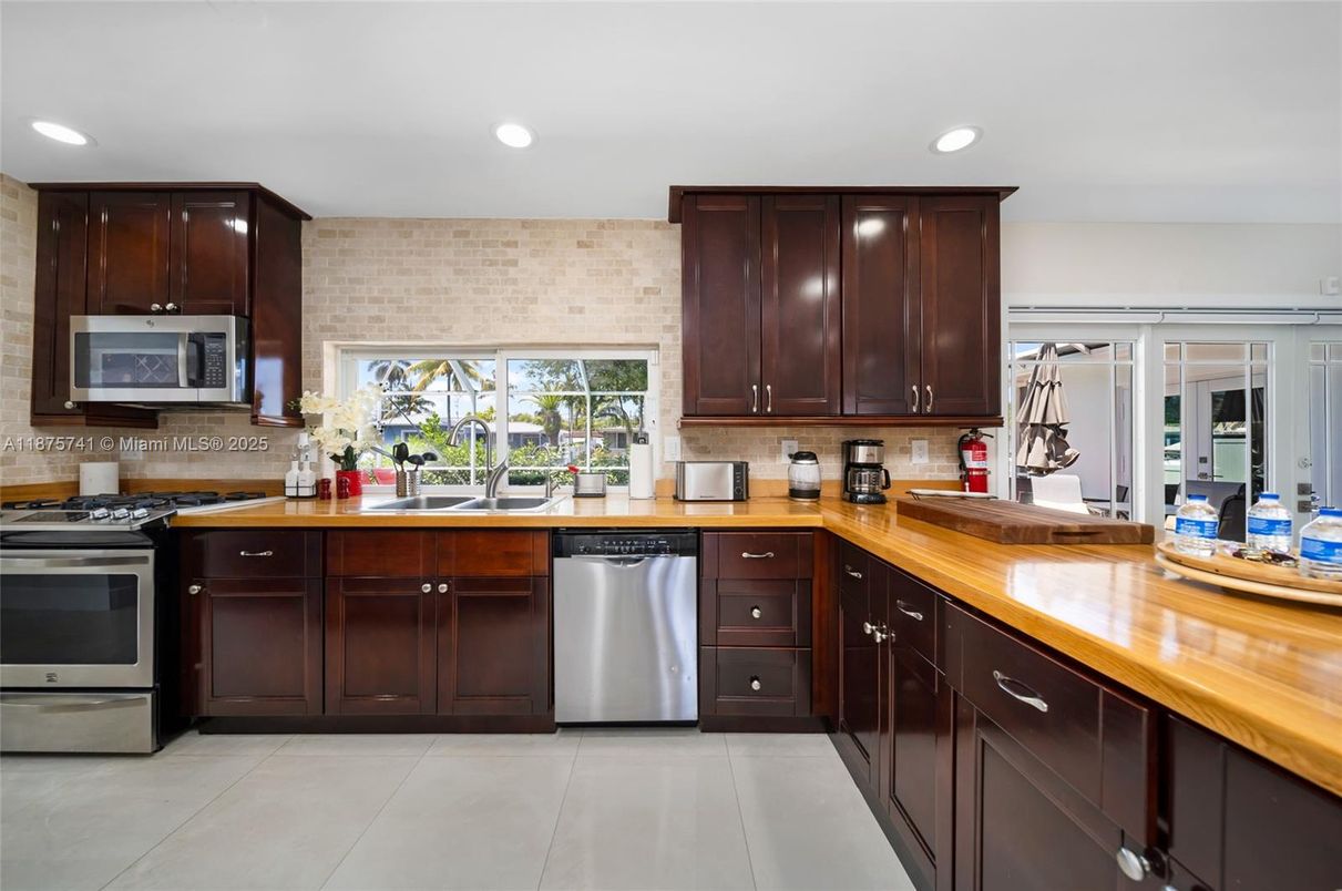Interior, Kitchen, Recessed Lighting, Stainless Steel Appliances, Stone Walls