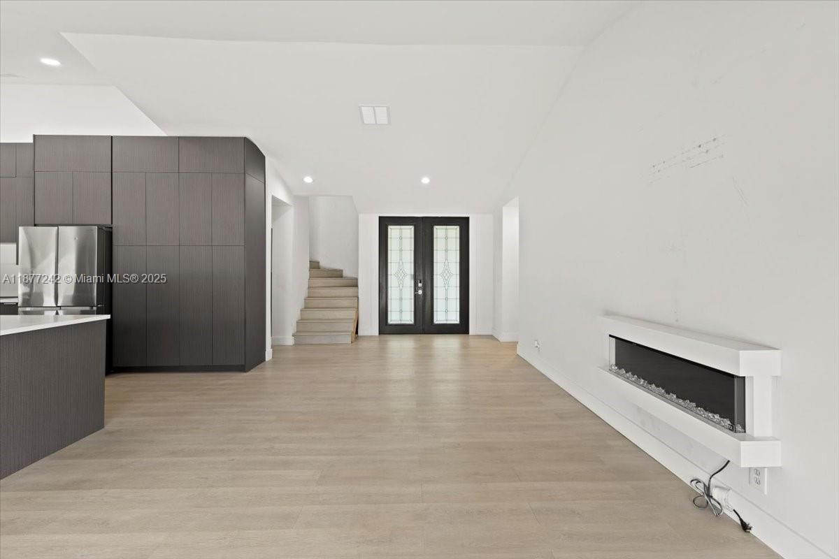Empty room, Fireplace, Interior, Kitchen, Recessed Lighting, Wood Texture Flooring