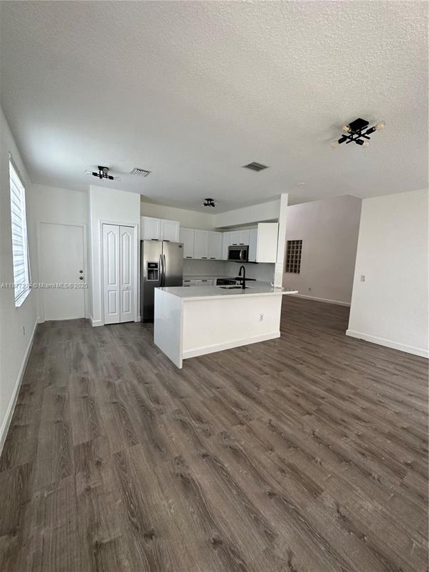 Empty room, Interior, Kitchen, Stainless Steel Appliances, Wood Texture Flooring