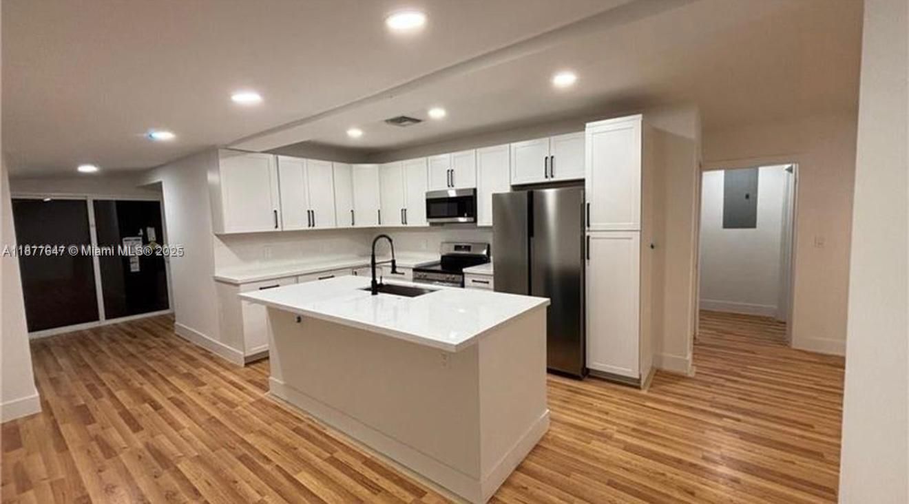 Interior, Kitchen, Recessed Lighting, Stainless Steel Appliances, Wood Texture Flooring