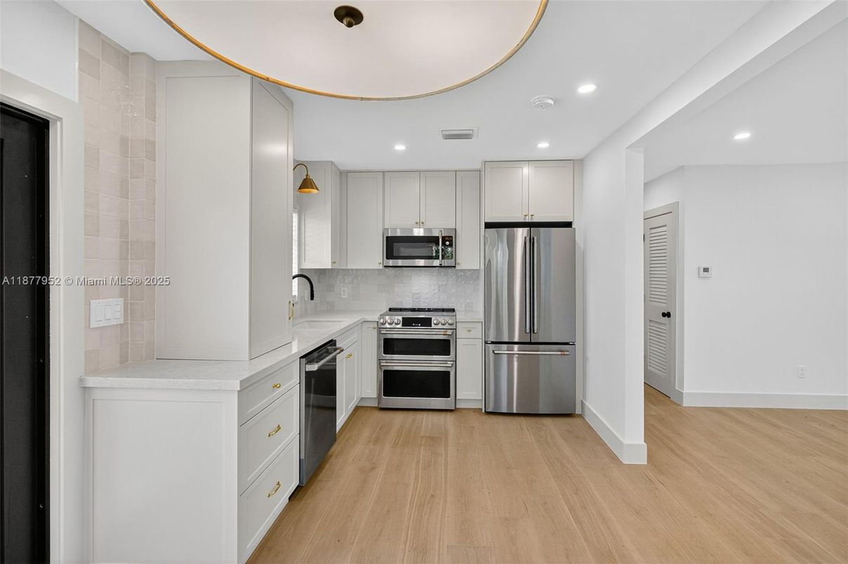 Interior, Kitchen, Pendant Lights, Recessed Lighting, Stainless Steel Appliances, Wood Texture Flooring