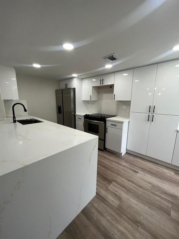 Interior, Kitchen, Marble Walls, Recessed Lighting, Wood Texture Flooring