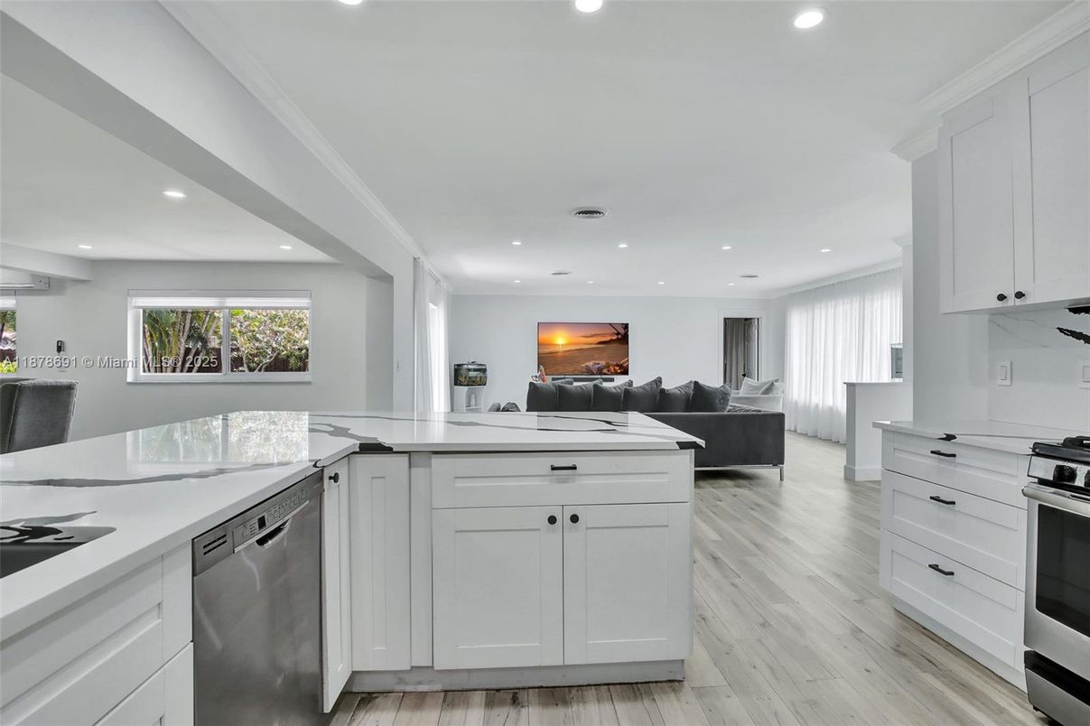 Dining room, Fireplace, Interior, Kitchen, Living room, Recessed Lighting, Stainless Steel Appliances, Wood Texture Flooring