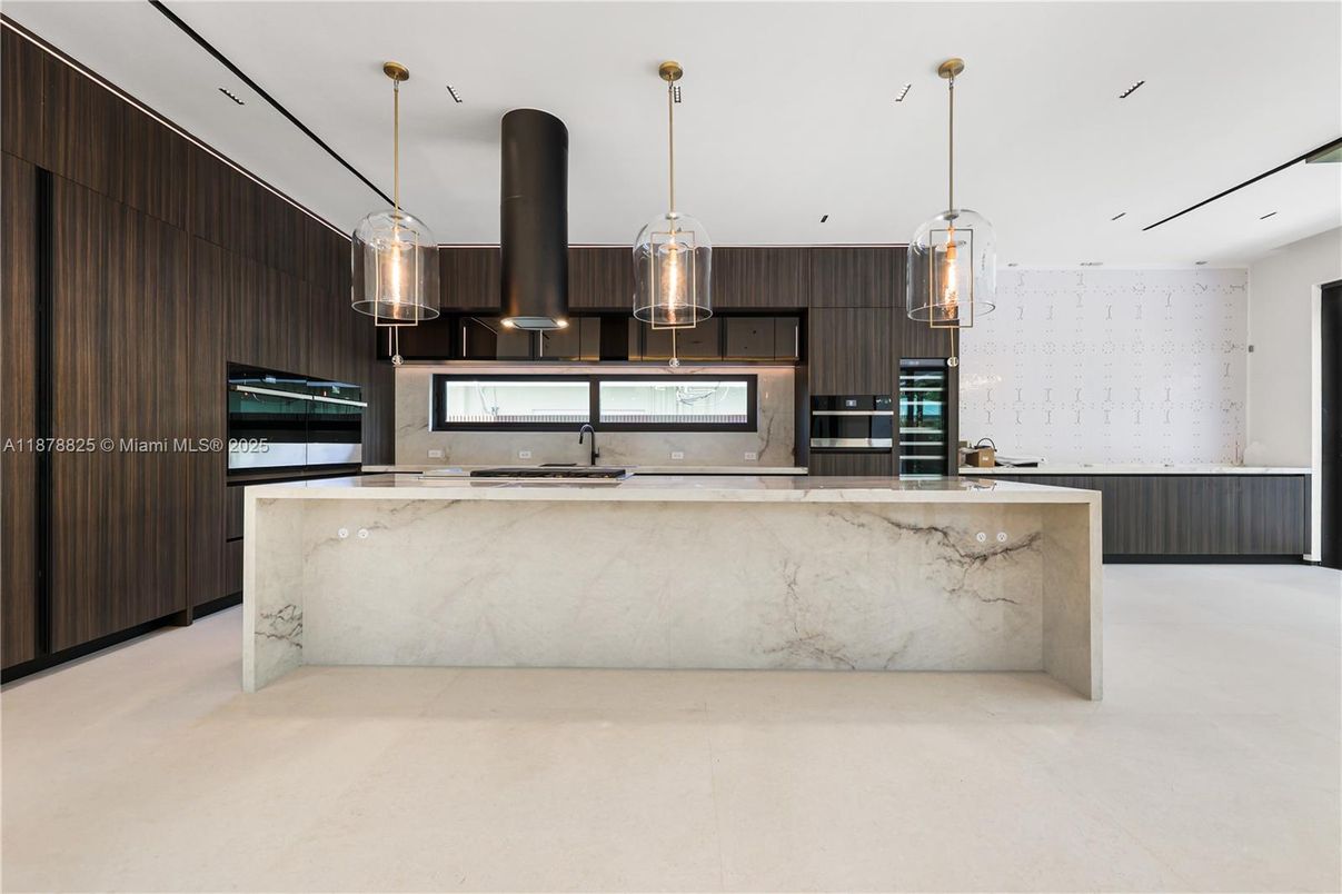 Interior, Kitchen, Marble Walls, Pendant Lights, Recessed Lighting, Stainless Steel Appliances
