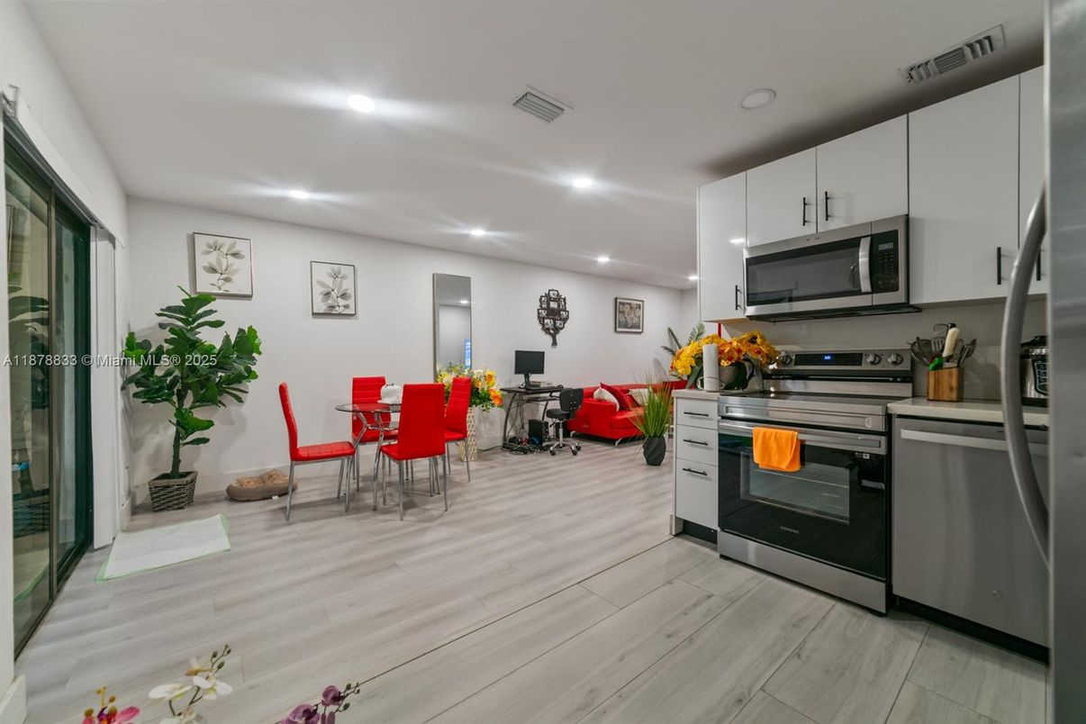 Dining room, Interior, Kitchen, Recessed Lighting, Stainless Steel Appliances, Wood Texture Flooring