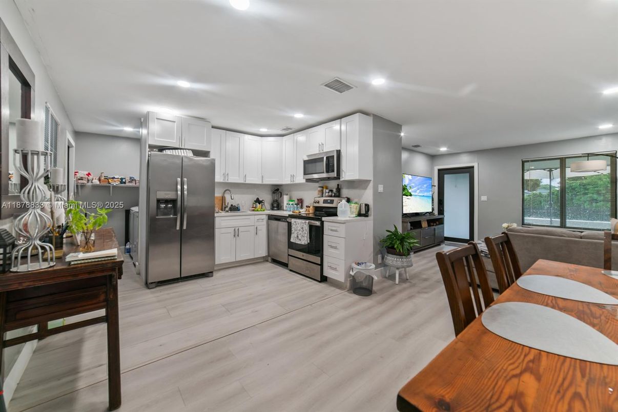 Dining room, Interior, Kitchen, Recessed Lighting, Stainless Steel Appliances, Wood Texture Flooring