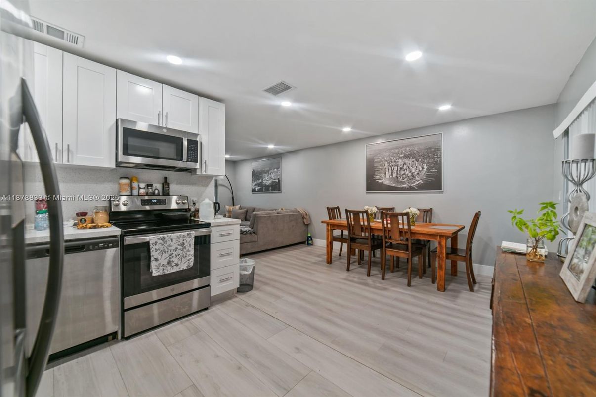 Dining room, Interior, Kitchen, Living room, Recessed Lighting, Stainless Steel Appliances, Wood Texture Flooring