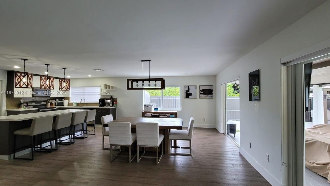 Dining room, Interior, Kitchen, Pendant Lights, Recessed Lighting, Stainless Steel Appliances, Wood Texture Flooring