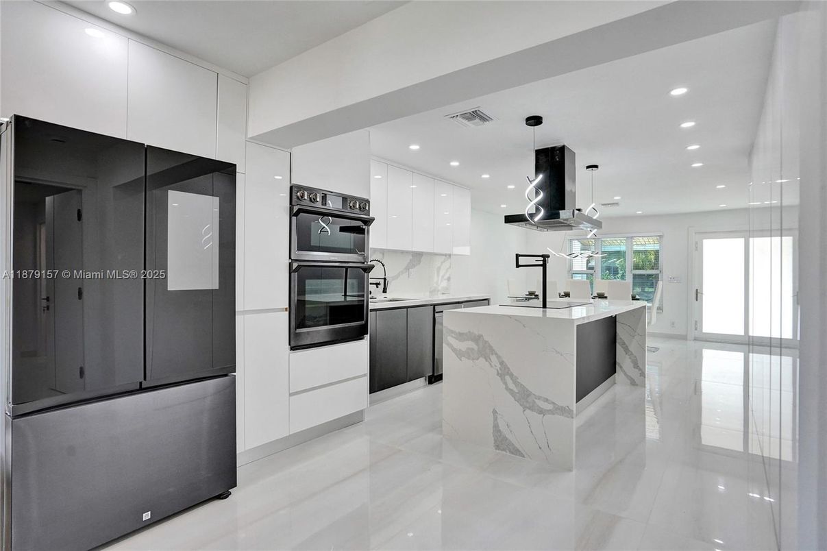 Interior, Kitchen, Marble Walls, Pendant Lights, Recessed Lighting, Stainless Steel Appliances