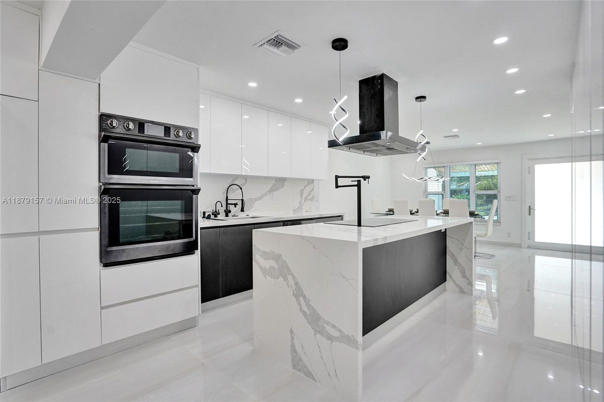 Interior, Kitchen, Marble Walls, Pendant Lights, Recessed Lighting, Stainless Steel Appliances