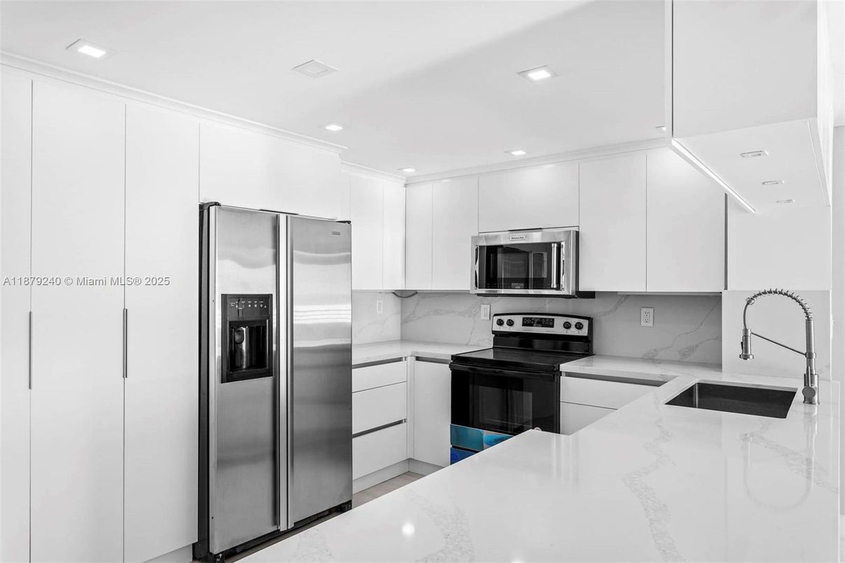 Interior, Kitchen, Marble Walls, Recessed Lighting, Stainless Steel Appliances