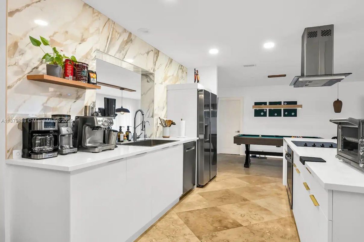 Interior, Kitchen, Marble Walls, Recessed Lighting, Stainless Steel Appliances