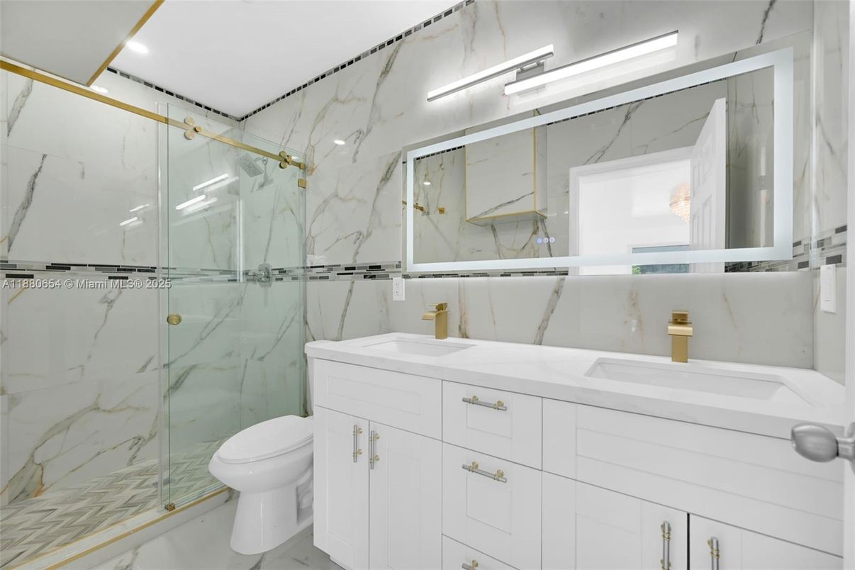 Bathroom, Dual Sink Vanities, Glass Shower, Interior, Marble, Marble Walls, Recessed Lighting