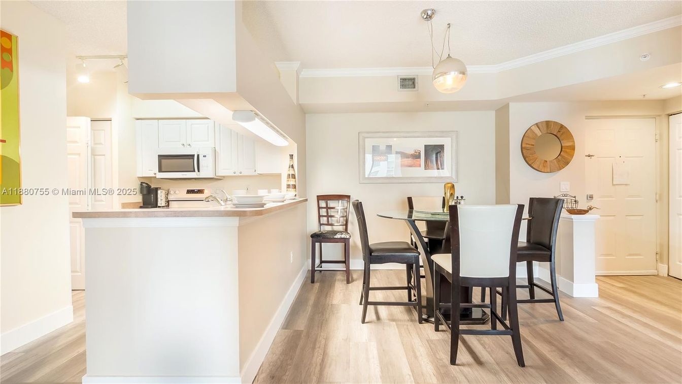 Dining room, Interior, Kitchen, Pendant Lights, Recessed Lighting, Stainless Steel Appliances, Wood Texture Flooring