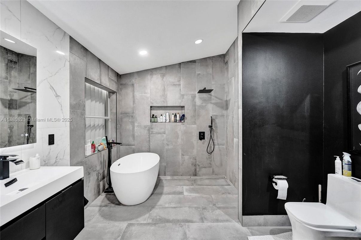 Bathroom, Dual Sink Vanities, Free Standing Baths, Glass Shower, Interior, Marble Walls, Recessed Lighting, Wooden Walls