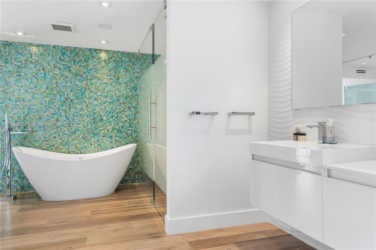 Bathroom, Free Standing Baths, Glass Shower, Interior, Recessed Lighting, Wood Texture Flooring