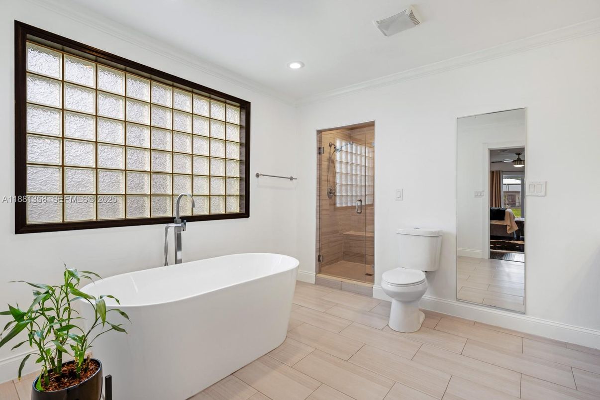 Bathroom, Free Standing Baths, Glass Shower, Interior, Recessed Lighting, Wood Texture Flooring