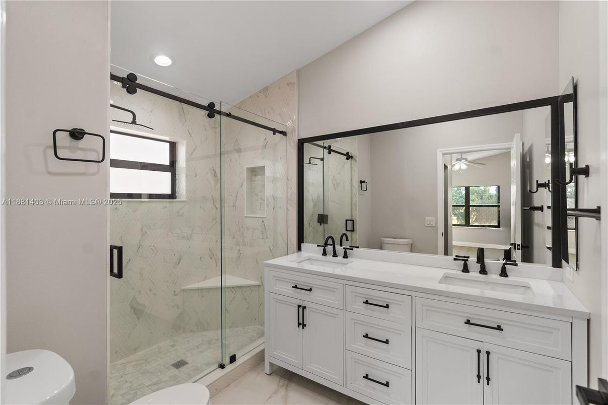 Bathroom, Dual Sink Vanities, Glass Shower, Interior, Marble, Marble Walls, Recessed Lighting