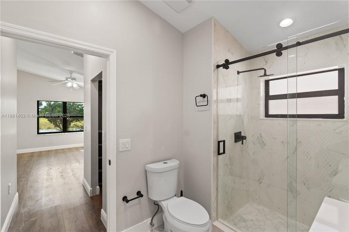 Bathroom, Glass Shower, Interior, Marble Walls, Recessed Lighting, Wood Texture Flooring