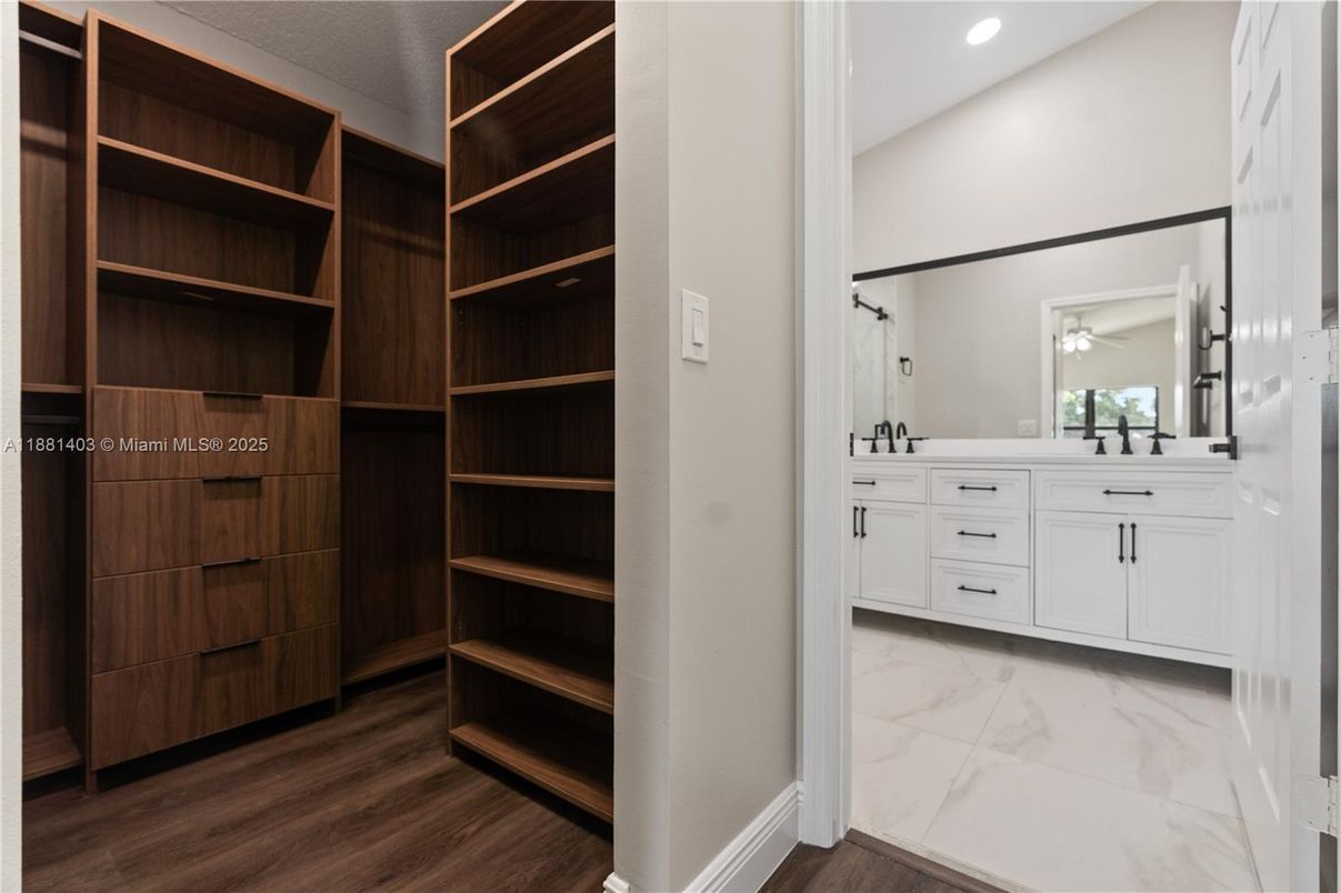Bathroom, Dual Sink Vanities, Interior, Marble, Recessed Lighting, Wood Texture Flooring