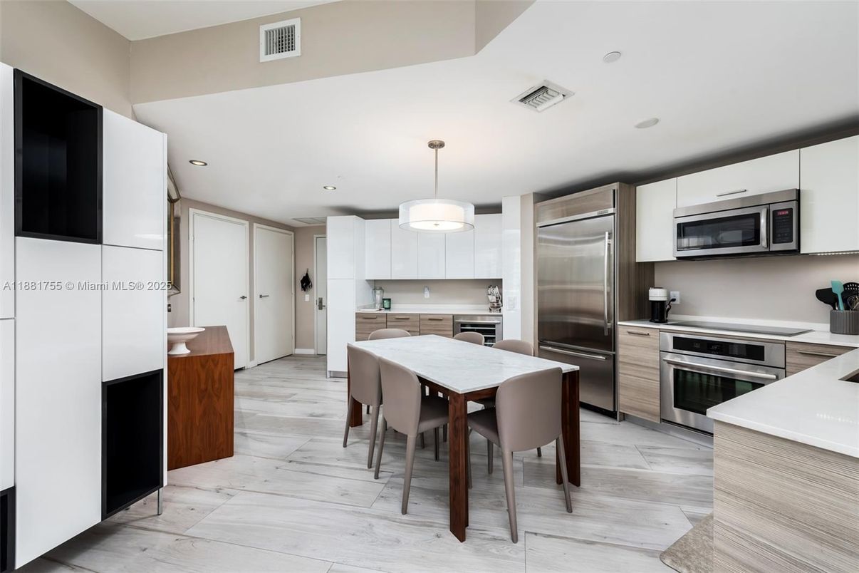 Dining room, Interior, Kitchen, Pendant Lights, Recessed Lighting, Stainless Steel Appliances, Wood Texture Flooring