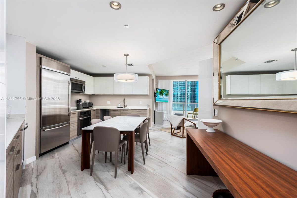 Dining room, Interior, Kitchen, Pendant Lights, Recessed Lighting, Stainless Steel Appliances, Wood Texture Flooring