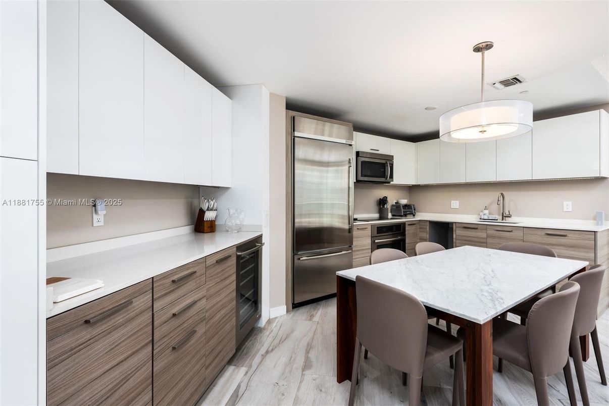 Dining room, Interior, Kitchen, Pendant Lights, Stainless Steel Appliances, Wood Texture Flooring