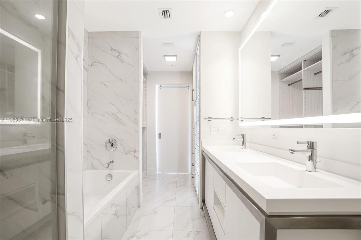 Bathroom, Dual Sink Vanities, Glass Shower, Interior, Marble, Marble Walls, Recessed Lighting