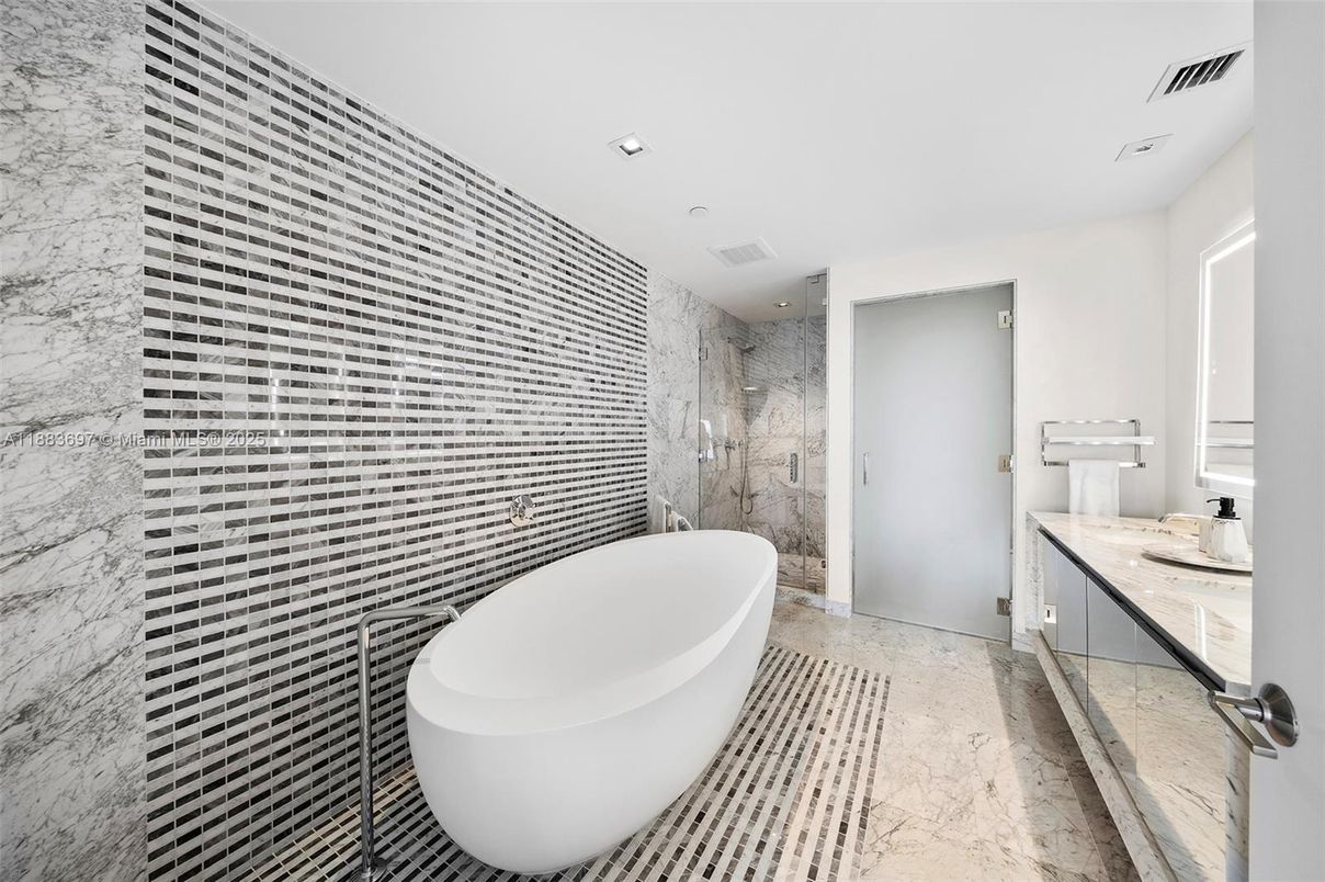 Bathroom, Free Standing Baths, Glass Shower, Interior, Marble, Marble Walls, Recessed Lighting