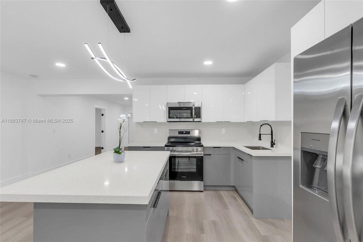 Interior, Kitchen, Pendant Lights, Recessed Lighting, Stainless Steel Appliances, Wood Texture Flooring