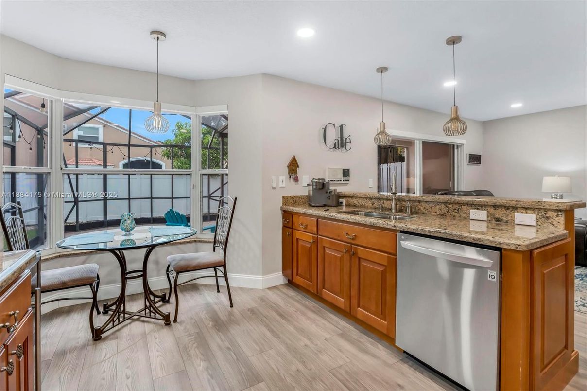 Dining room, Interior, Kitchen, Pendant Lights, Recessed Lighting, Stainless Steel Appliances, Wood Texture Flooring