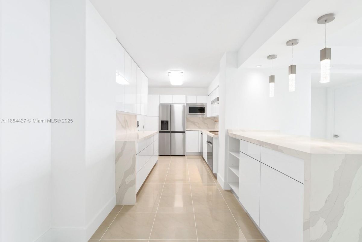 Interior, Kitchen, Marble Walls, Pendant Lights, Stainless Steel Appliances