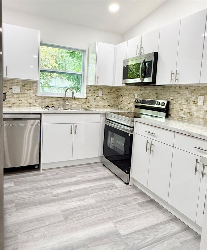 Interior, Kitchen, Recessed Lighting, Stainless Steel Appliances, Wood Texture Flooring