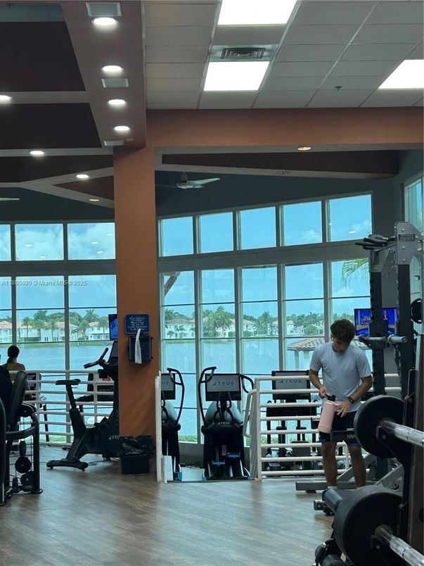 Fitness Equipment, Gym, Interior, Recessed Lighting, Water, Wood Texture Flooring