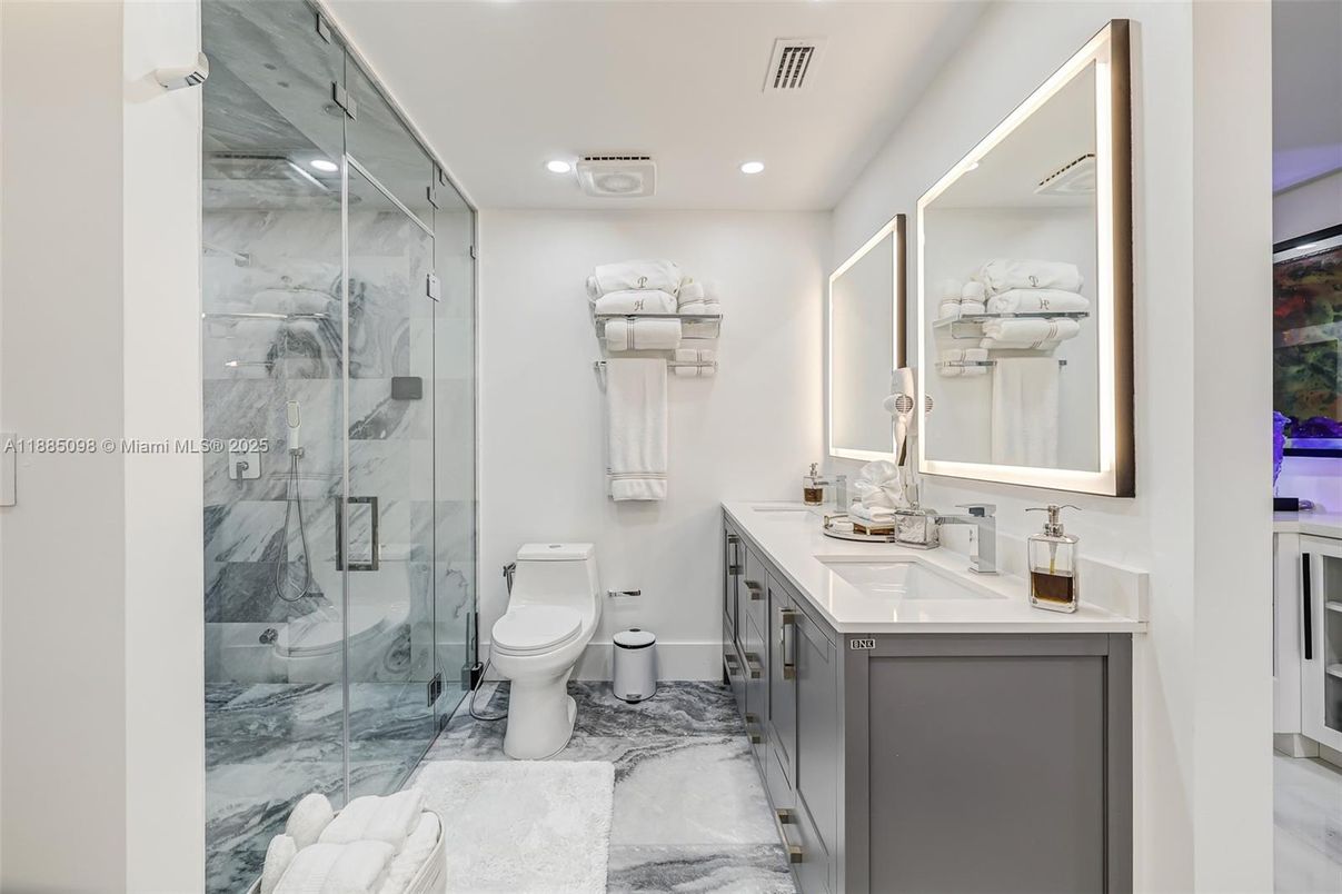 Bathroom, Dual Sink Vanities, Glass Shower, Interior, Marble, Marble Walls, Recessed Lighting