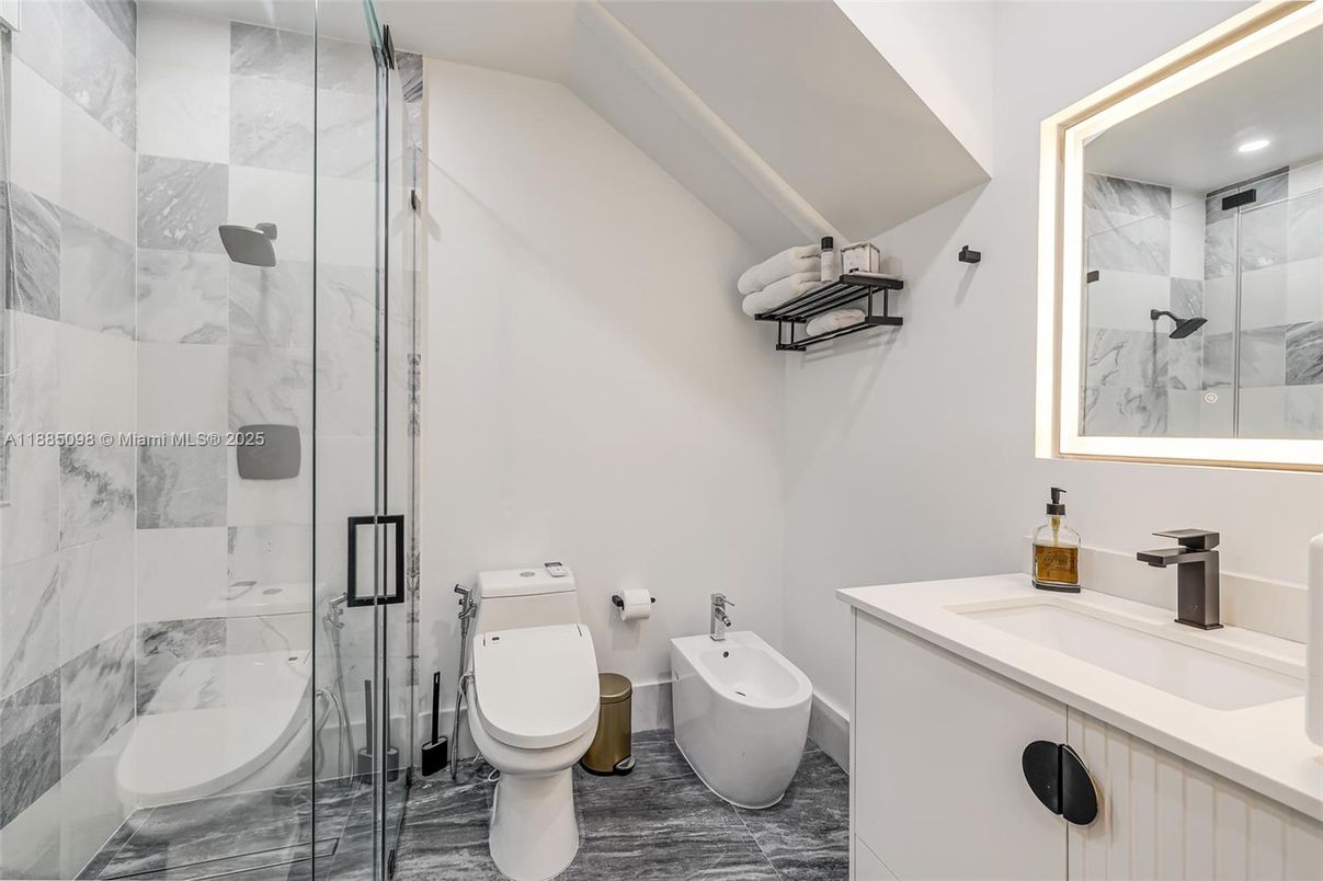 Bathroom, Dual Sink Vanities, Glass Shower, Interior, Marble Walls, Recessed Lighting
