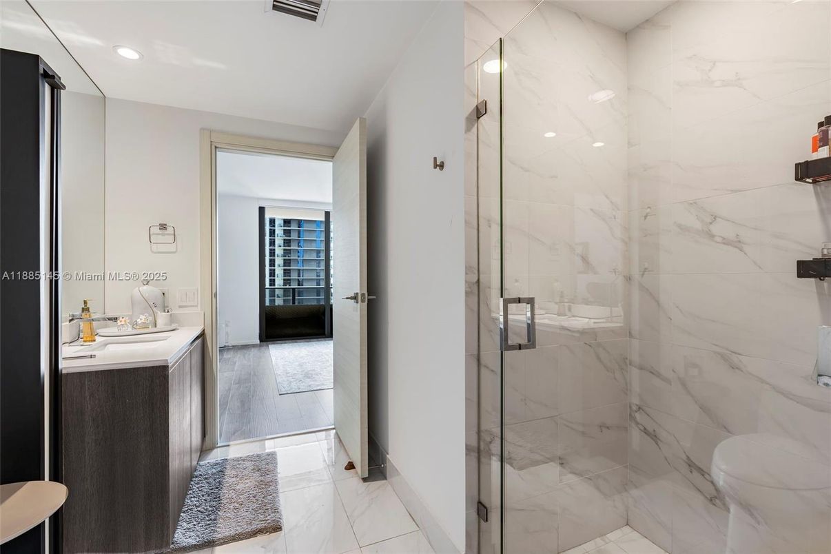 Bathroom, Glass Shower, Interior, Marble, Marble Walls, Recessed Lighting, Wood Texture Flooring