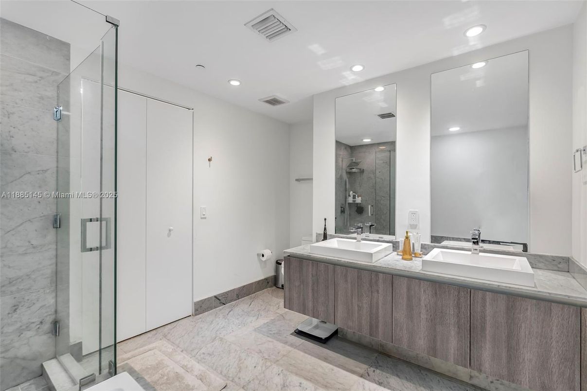 Bathroom, Dual Sink Vanities, Glass Shower, Interior, Marble, Marble Walls, Recessed Lighting