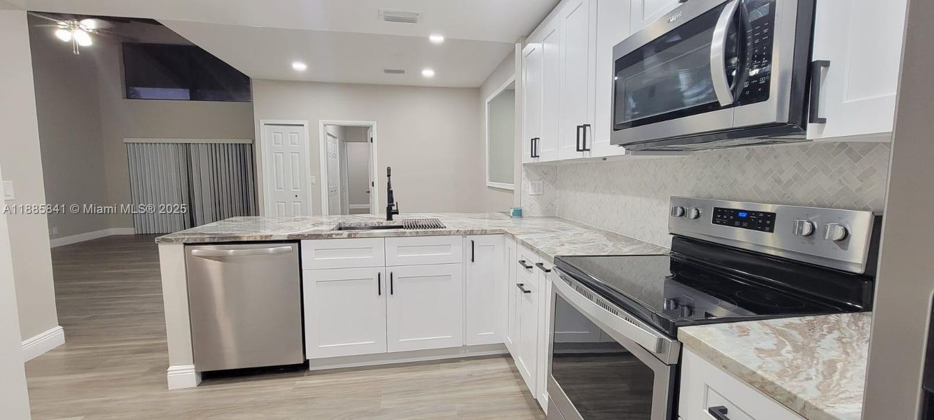 Interior, Kitchen, Recessed Lighting, Stainless Steel Appliances, Wood Texture Flooring