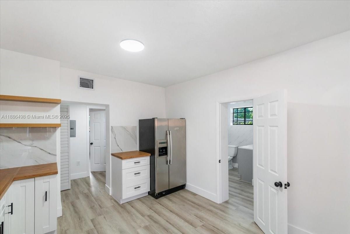 Interior, Kitchen, Marble Walls, Stainless Steel Appliances, Wood Texture Flooring
