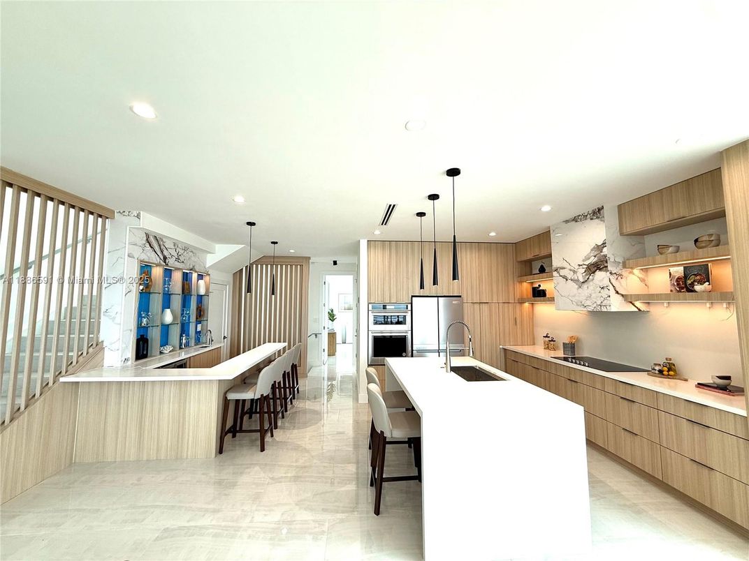 Interior, Kitchen, Marble Walls, Pendant Lights, Recessed Lighting, Stainless Steel Appliances