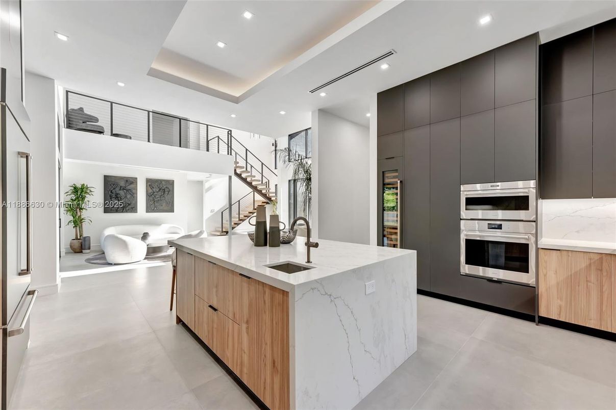 Interior, Kitchen, Marble Walls, Recessed Lighting, Stainless Steel Appliances