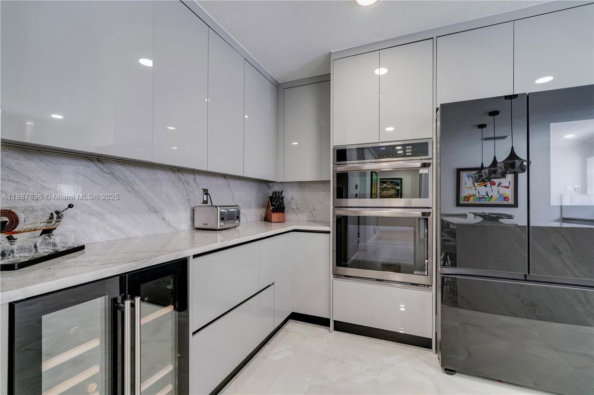Interior, Kitchen, Marble Walls, Recessed Lighting, Stainless Steel Appliances