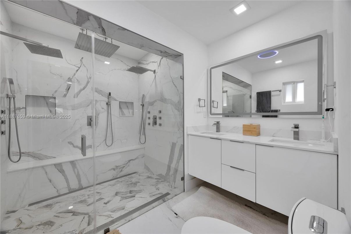 Bathroom, Dual Sink Vanities, Glass Shower, Interior, Marble, Marble Walls, Recessed Lighting