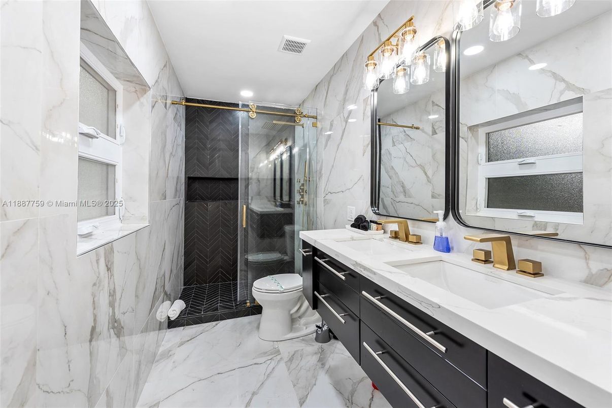 Bathroom, Dual Sink Vanities, Glass Shower, Interior, Marble, Marble Walls, Recessed Lighting