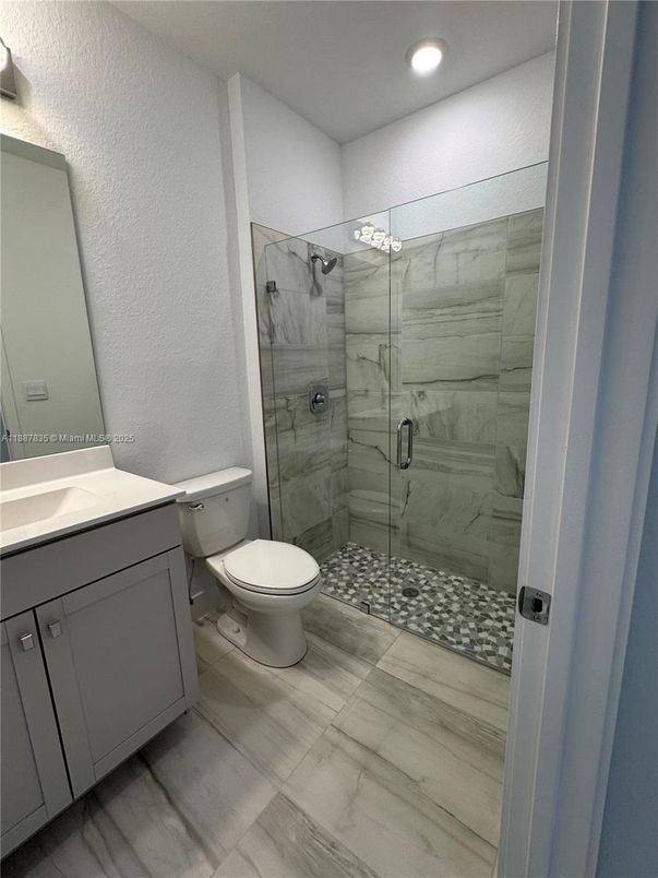 Bathroom, Glass Shower, Interior, Marble Walls, Recessed Lighting, Wood Texture Flooring